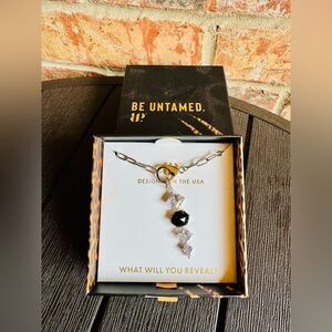 Bomb Party Untamed NK30368 Drip with Bite Necklace in Rhodium Plating.